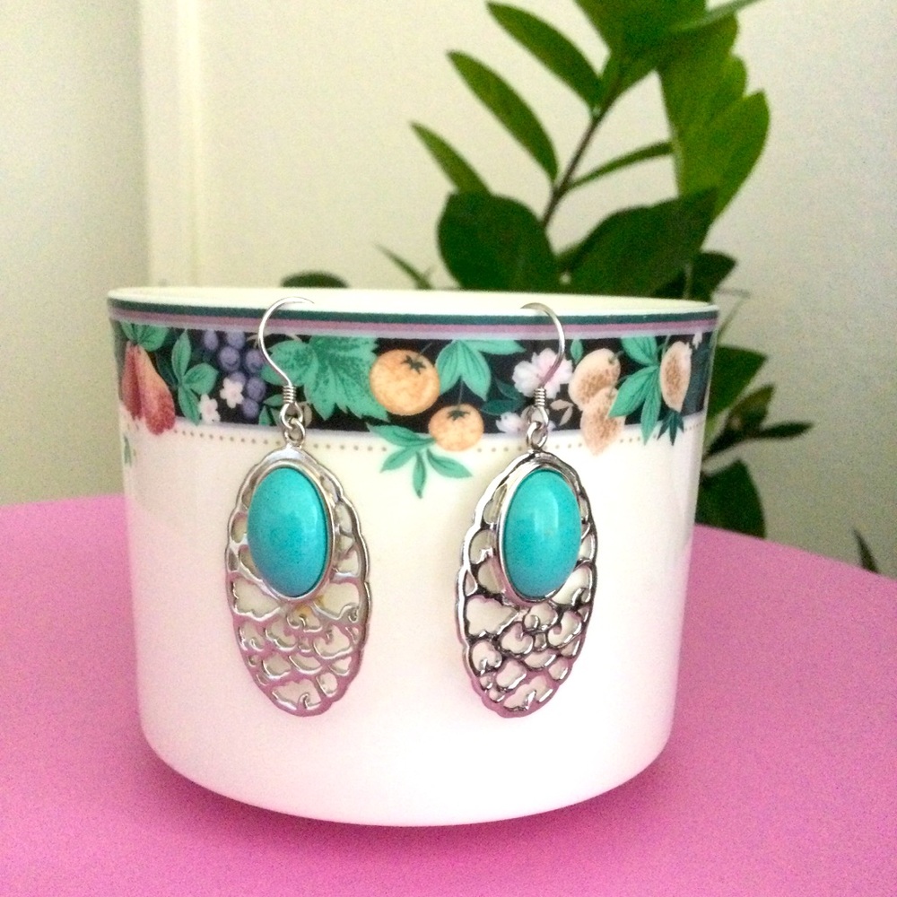 925 Silver and Turquoise Oval Earrings dangling.